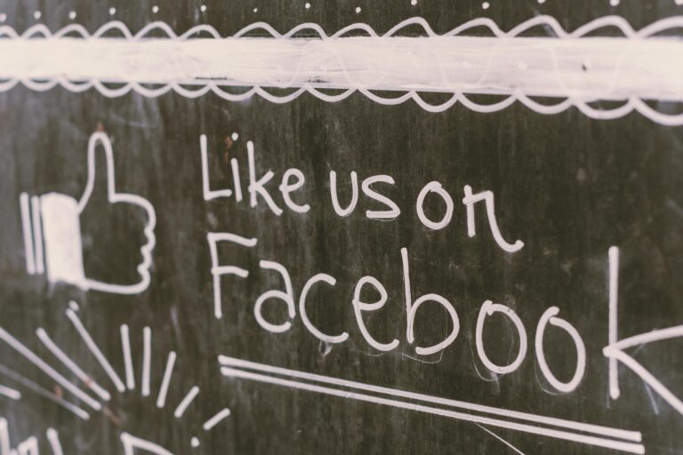 Chalkboard art promoting Facebook engagement with a like us message.